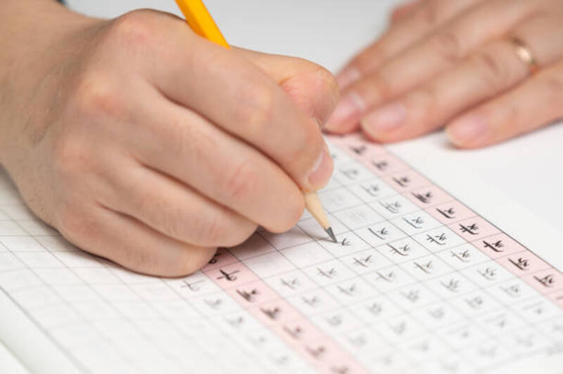 Hand Practicing Korean Characters on a Workbook Hand Practicing Korean Characters on a Workbook hangeul stock pictures, royalty-free photos &amp; images