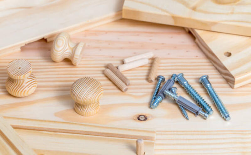 Furniture assembly Close up of Furniture assembly kit on wood plank background knock down furniture stock pictures, royalty-free photos &amp; images