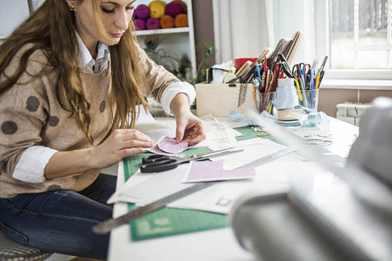 Creative occupation Artisan woman working in her atelier, creative business owner cutting paper stock pictures, royalty-free photos &amp; images
