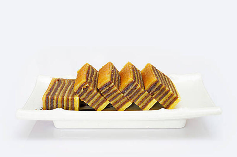Multi-layered Cake Multi-layered cake called "lapis legit" or "spekkoek" from Indonesia, isolated on white background. lapis legit stock pictures, royalty-free photos &amp; images