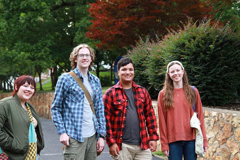 Group of College Students Standing Together on Campus Shot of diverse group of college students standing outdoors on campus flannel stock pictures, royalty-free photos &amp; images