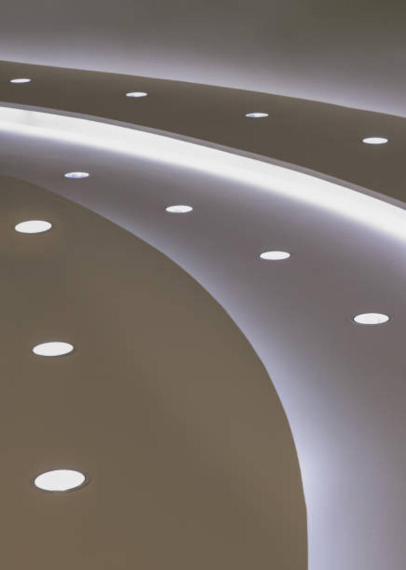 Gypsum curved ceiling with LED ceiling lights. Gypsum curved ceiling with LED ceiling lights. Circle ceiling cove light design decoration, Recessed ceiling luminaires. Copy space, Selective focus. downlight led stock pictures, royalty-free photos & images