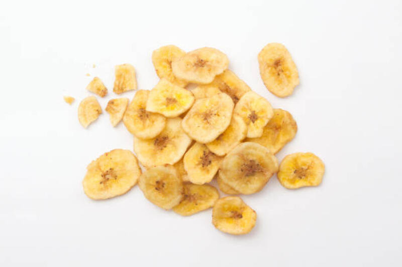 Banana chips with broken isolated on white background. Banana chips with broken isolated on white background , top view , flat lay. banana chips stock pictures, royalty-free photos &amp; images