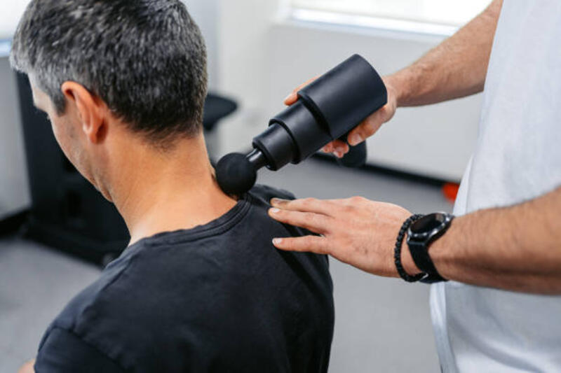 Physical Therapist Massaging His Male Client