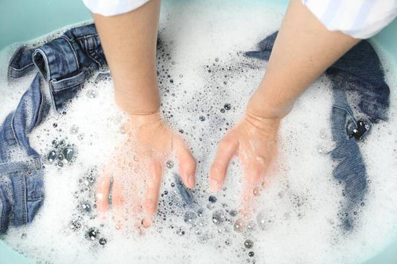 woman-washing-denim-clothes-with-soap-and-water-in-basin-top-view.jpg (612×408)