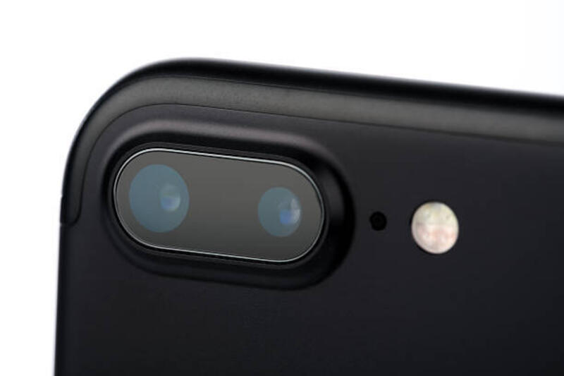Apple iPhone 7 Plus Mat Black Dual Lens Camera Montreal, Canada - September 16, 2016: Newest Apple iPhone 7 Plus mat Black isolated on white background. The new dual lens camera and the new flash are located on the back of the smartphone. phone camera lens protector stock pictures, royalty-free photos & images