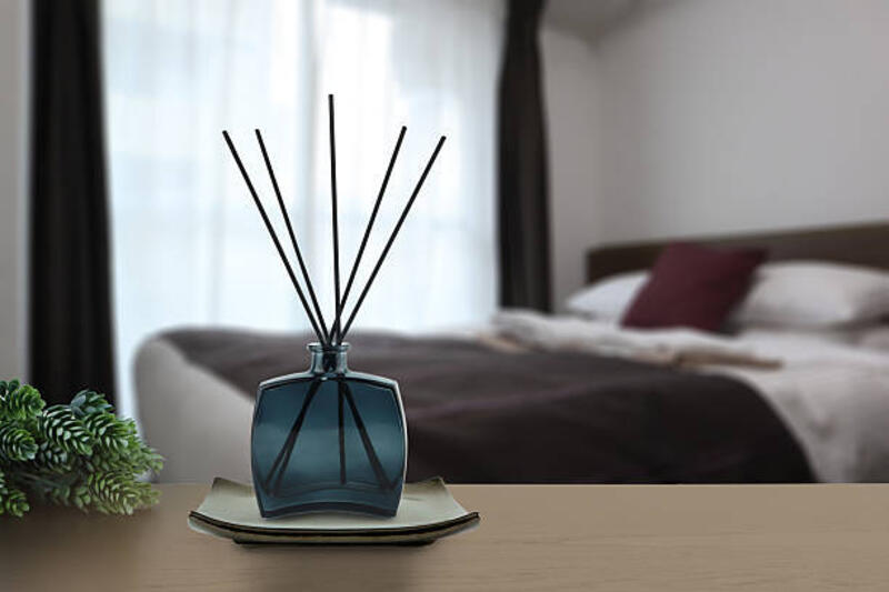 luxury aroma reed diffuser air freshener on table in nice design bedroom to create good relax ambient home house decoration - reed diffuser in bedroom potret stok, foto, &amp; gambar bebas royalti
