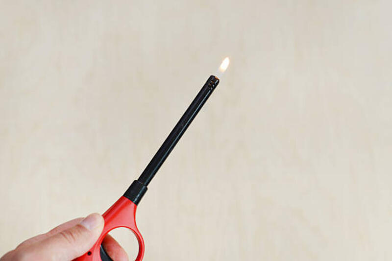 lighter in hand - pemantik api potret stok, foto, &amp; gambar bebas royalti