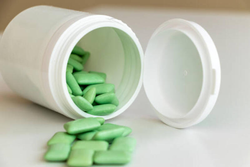 Granular gum spilled from an container Granular gum spilled from an container xylitol gum stock pictures, royalty-free photos &amp; images