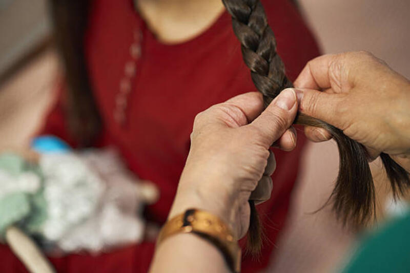 Grandma Braiding Her Granddaughter At Hospital High angle view of grandma braiding her granddaughter at hospital braiding hair stock pictures, royalty-free photos &amp; images