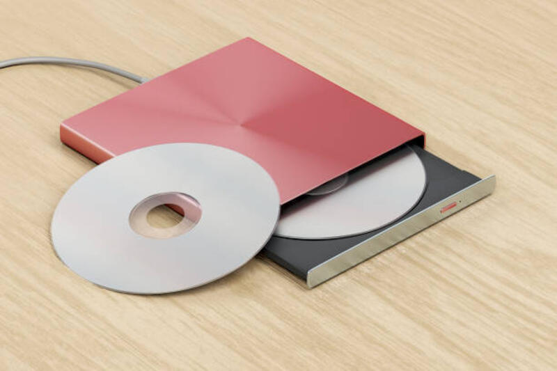 External optical drive External optical drive on wood table dvd external stock pictures, royalty-free photos &amp; images